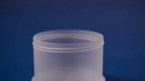 Pouring white powder in a container. Supplement, creatine, hmb, bcaa or vitamin Stock Footage 77727935