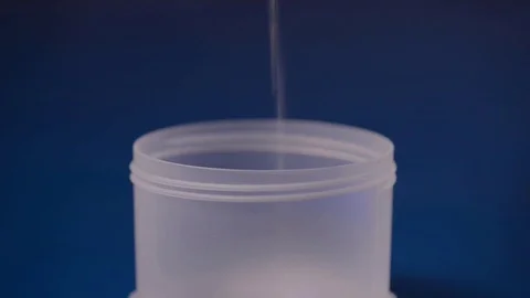 Pouring white powder in a container. Supplement, creatine, hmb, bcaa or vitamin Stock Footage 77727988