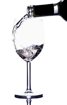Pouring white vine Fotos de archivo