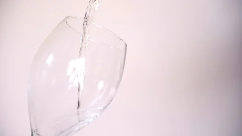 Pouring White Wine In Slow Motion Stock Footage 128532758
