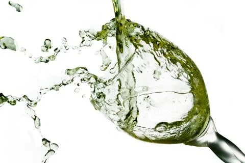 Pouring white Wine Splashes Into A Crystal Wine Glass  Foto stock