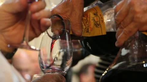 Pouring wine from decanter Stock Footage