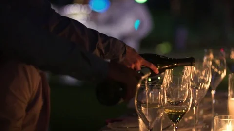 Pouring wine at a dinner party Video stock 73066328
