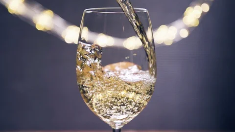 Pouring Wine into glass, close up super slow motion Stock Footage 128922453