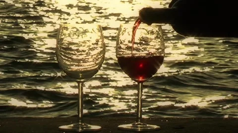 Pouring Wine into Glasses at Sunset Stock Footage 51983687