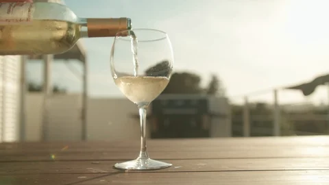 Pouring wine at sunset handheld camera Stock Footage 124769179