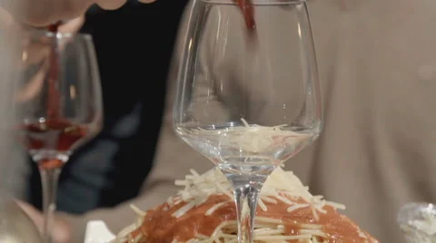 Pouring wine in two glasses at the same time Stock Footage 61079018