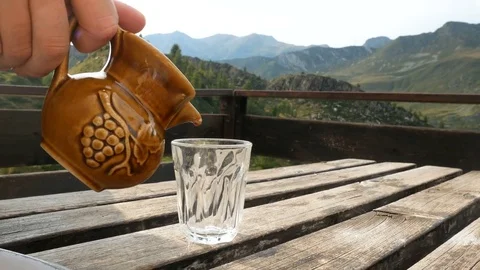 Pouring wine from typical carafe. 스톡 동영상 79655754