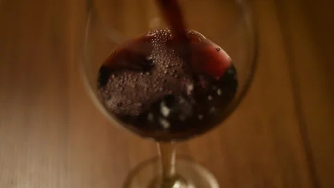 Pouring wine on a wood table Video stock 141706973