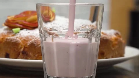 Pouring yogurt into a glass Stock Footage 155298570