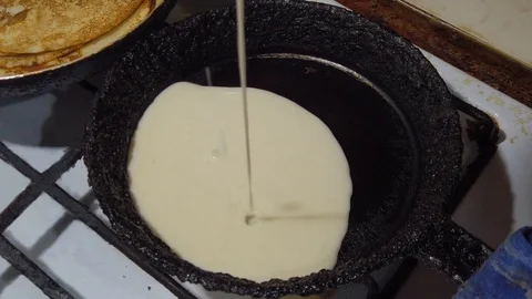 Pours batter for pancakes Video stock 114116121