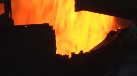 Pours burning coal fire Stock Footage 56937783