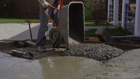 Pours concrete mixture into the foundation Stock Footage 307384502