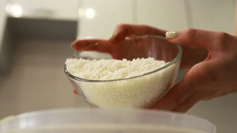 Pours cottage cheese into a container for making a cake Stock Footage 130231266