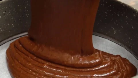 Pours the Cream into a saucepan. Slow motion Stock Footage 155298612