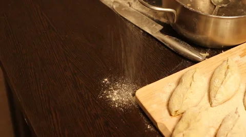 Pours flour on the table Stock Footage 57354194