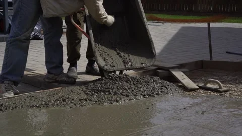 Pours the foundation with the mixture by hand Stock Footage 307384287