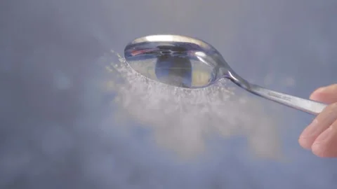 Pours out the sugar close-up. selective focus. slow motion Stock Footage 152895496
