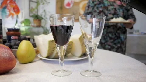 Pours red wine into glasses Stock Footage 255240238