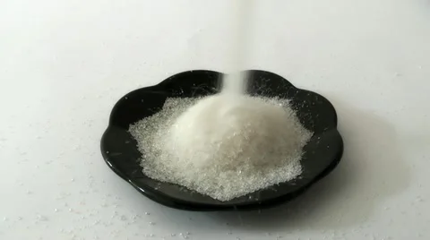 Pours sugar on a plate Stock Footage 11290164