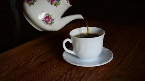 Pours tea into a cup Stock Footage 116478541