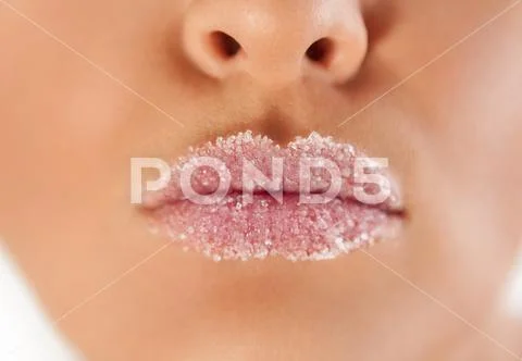 Pouting female lips covered with sugar Stock Photos