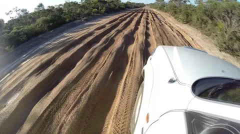 POV 4x4 driving on mud track with deep ruts and puddles Stock Footage 61452404