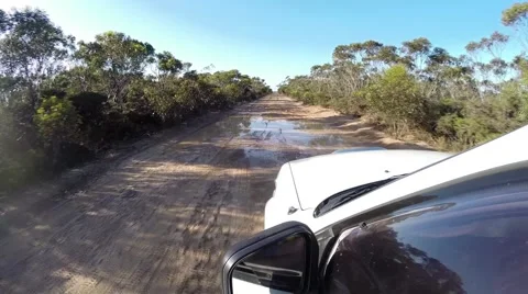 POV 4x4 driving on muddy path through big puddles Stock Footage 61421501