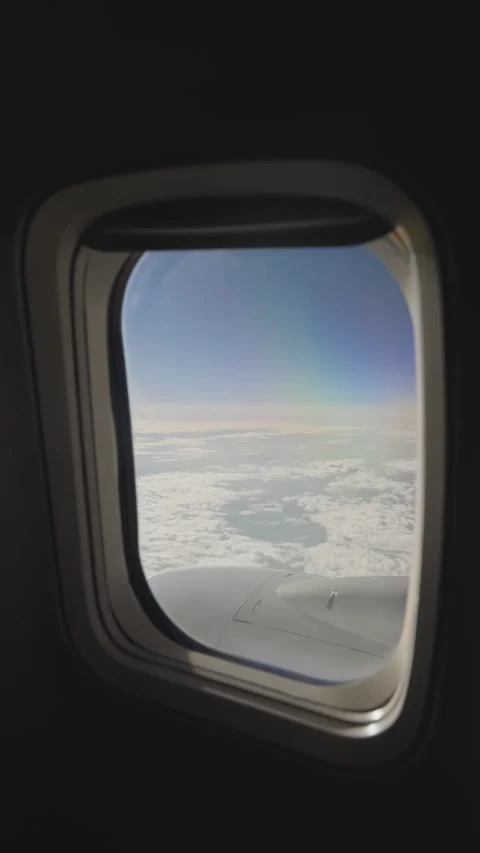 POV above clouds seen through airplane window Stock Footage 320359720