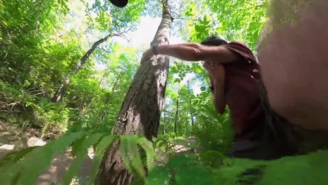 POV action camera clip of a mountain biker hitting a tree and then falling Stock Footage 249423828