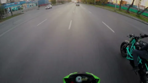 POV action camera shoot of professional stunt driver while motorcycle moving on Stock Footage 105049357