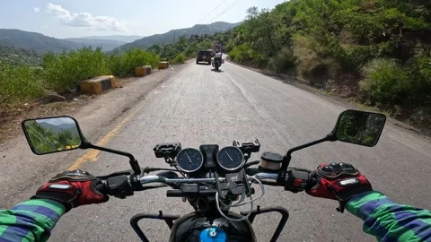 POV action camera shot riding a motorbike in Pakistan, mountains of Kashmir. Stock Footage 269792990