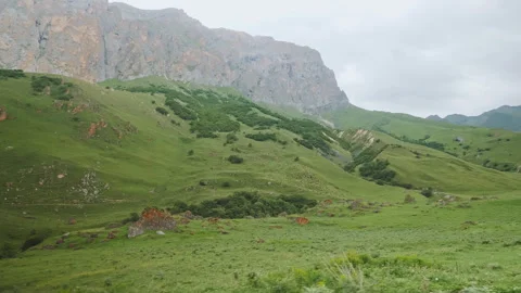 POV Action Driving View Of Massive Rocky Mountain Cliffs And Green Valley Vídeos de archivo 346889881