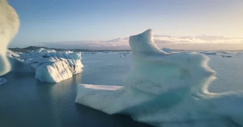 POV aerial flight between glaciers Jökulsárlón glacial lagoon Iceland 4K UHD Stock Footage