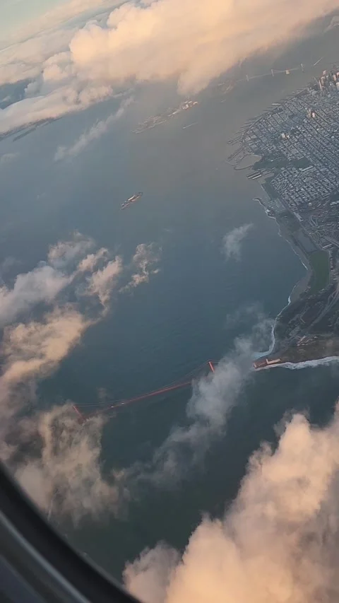 POV air plane window view looking down at Golden Gate Bridge. Stock Footage 340359835