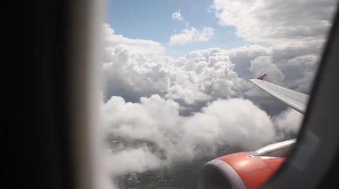 POV Airplane from inside beautiful clouds, wing and engine Stock Footage 45067924