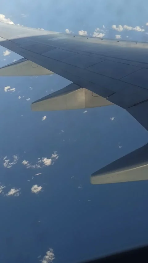 POV: Airplane Window Shade And Reveals Bright Blue Sky. Stock Footage 167854130