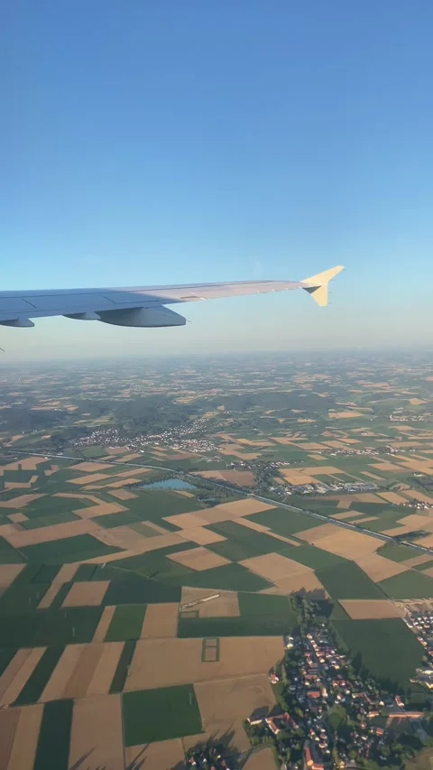 POV Airplane Window View Flying Over Bavarian Countryside Munich - Jul 10 2026 Stock-Footage 339735444