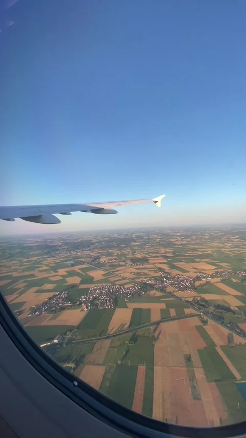 POV Airplane Window View Flying Over Bavarian Countryside Munich - Jul 10 2026 Stock Footage 339735456