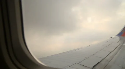 POV of airplane wing as it's flying Stock Footage 33750799