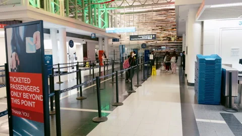 POV Airport security checkpoint with queue barriers, signage for ticke Video stock 325692246