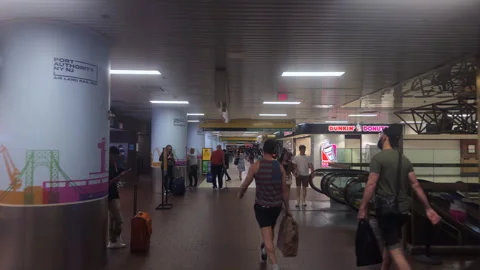 POV Among Crowds on Upper Level of Port Authority Bus Terminal North Wing Stock Footage 347929254