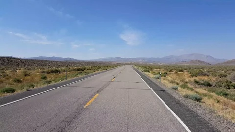POV angle of car moving on Nevada desert road Stock Footage 95487974