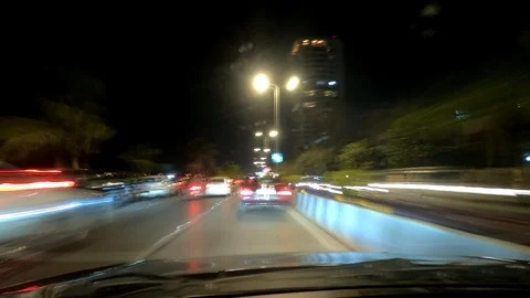 POV angle Timelapse hyperlapse of driving a car on a busy highway at night Stock Footage 126511656