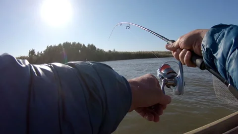 POV of the angler fighting with fish Stock Footage 142589661