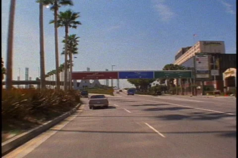POV approaching LAX, pass LAX sign Stock Footage 869433