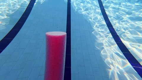 POV Aquatic Exercise Using Foam Pool Noodle in Swimming Pool 動画素材 340899396