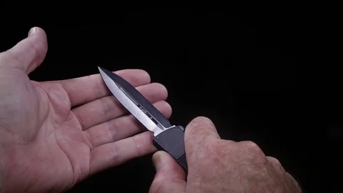 POV Automatic Knife Stock Footage 76019698