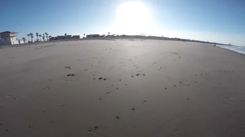 POV Beach Ride Gliding Floating Sand Sunny Stock Footage 289572751