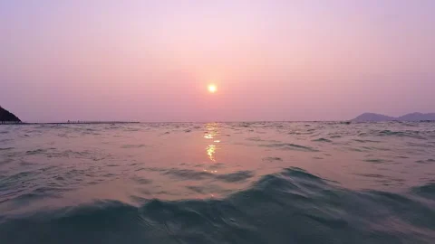POV beautiful sunset with pink sky while surfing through the waves. Video stock 284948112
